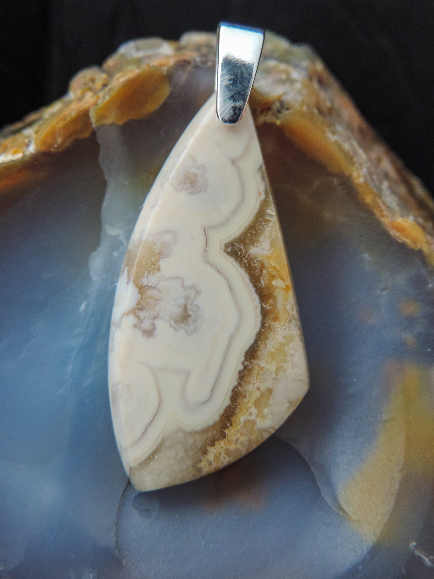 Find your perfect Indonesian Agate on our store!  The pendant bail is authentic 925 sterling silver.