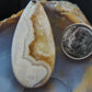 Our hand crafted jewelry is photographed next to a ruler for size.  This stone is a natural color, no dyes or heat treatment have been used.  It was photographed without filters on automatic setting in natural light; however, slight color variations may occur due to digitization.  Natural stones can have nooks and crannies, inclusions or small cracks, these distinguishing features lend character to the piece.