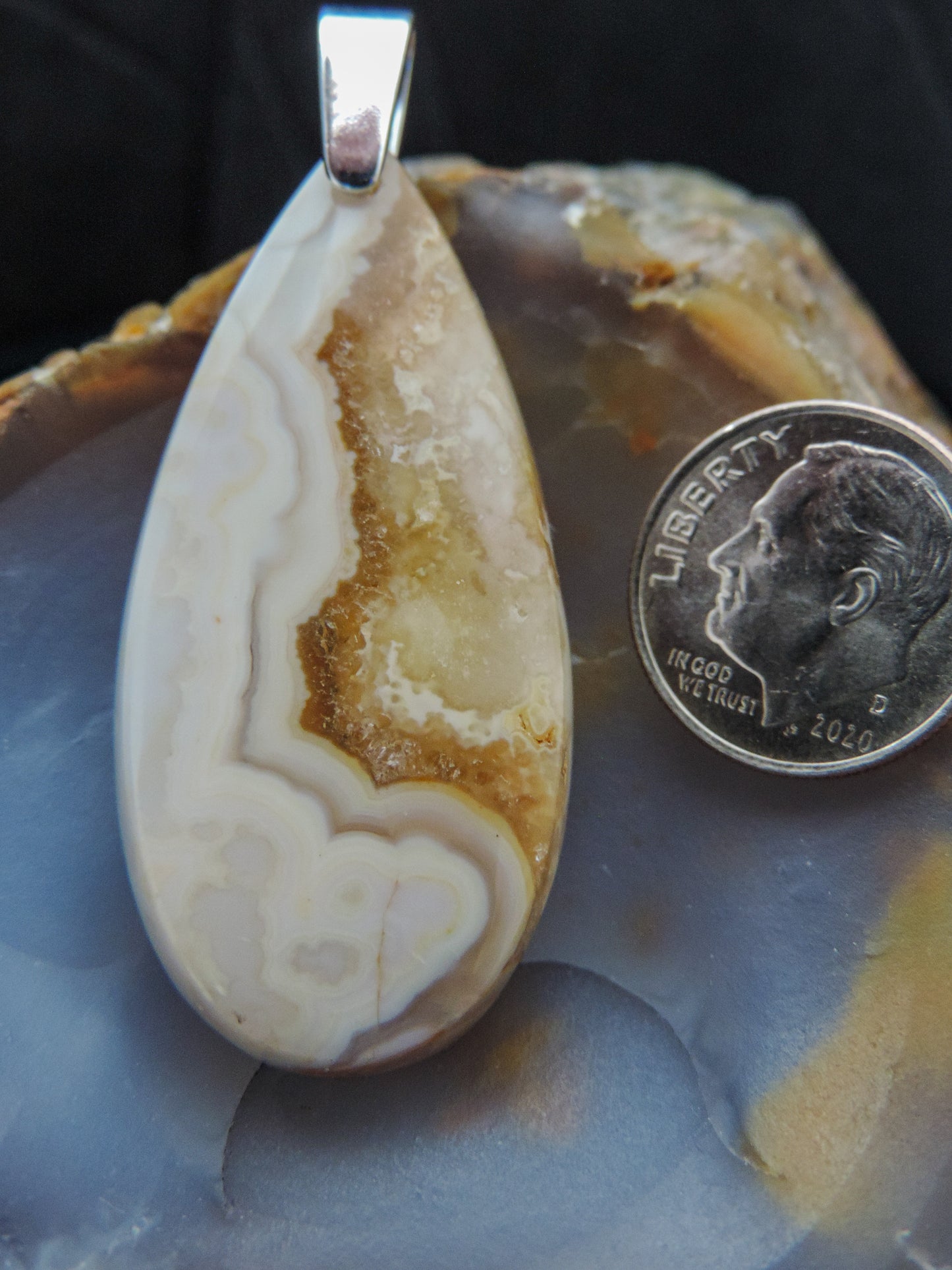 Our hand crafted jewelry is photographed next to a ruler for size.  This stone is a natural color, no dyes or heat treatment have been used.  It was photographed without filters on automatic setting in natural light; however, slight color variations may occur due to digitization.  Natural stones can have nooks and crannies, inclusions or small cracks, these distinguishing features lend character to the piece.