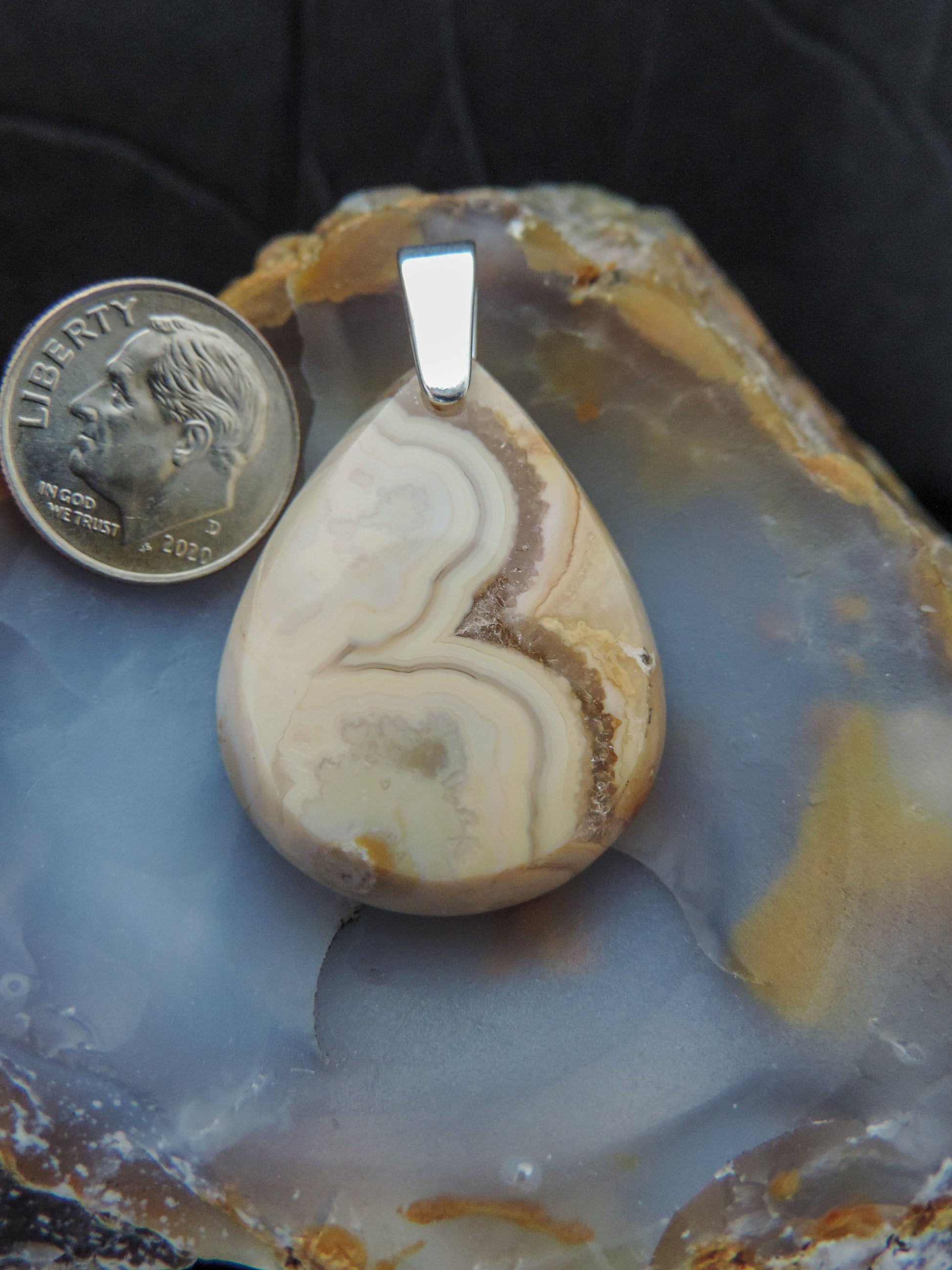 Find your perfect Indonesian Agate on our store!  The pendant bail is authentic 925 sterling silver. 