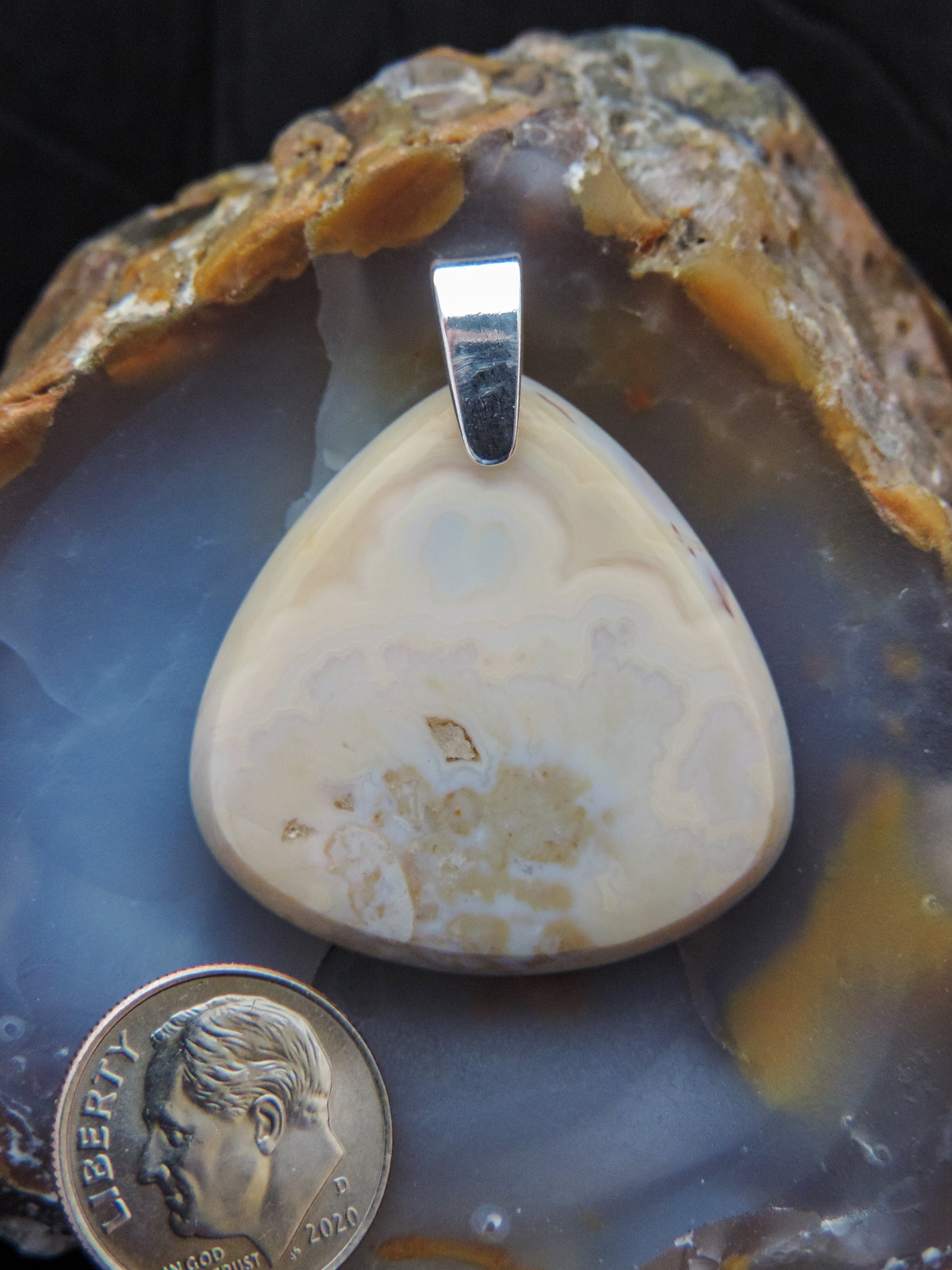 Find your perfect Indonesian Brown Lace Agate & Sterling Silver Pendant on our store!  The pendant bail is authentic 925 sterling silver.   Our hand crafted jewelry pendant is photographed next to a ruler for size.  This stone is a natural color, no dyes or heat treatment have been used.  It was photographed without filters on automatic setting in natural light; however, slight color variations may occur due to digitization.  