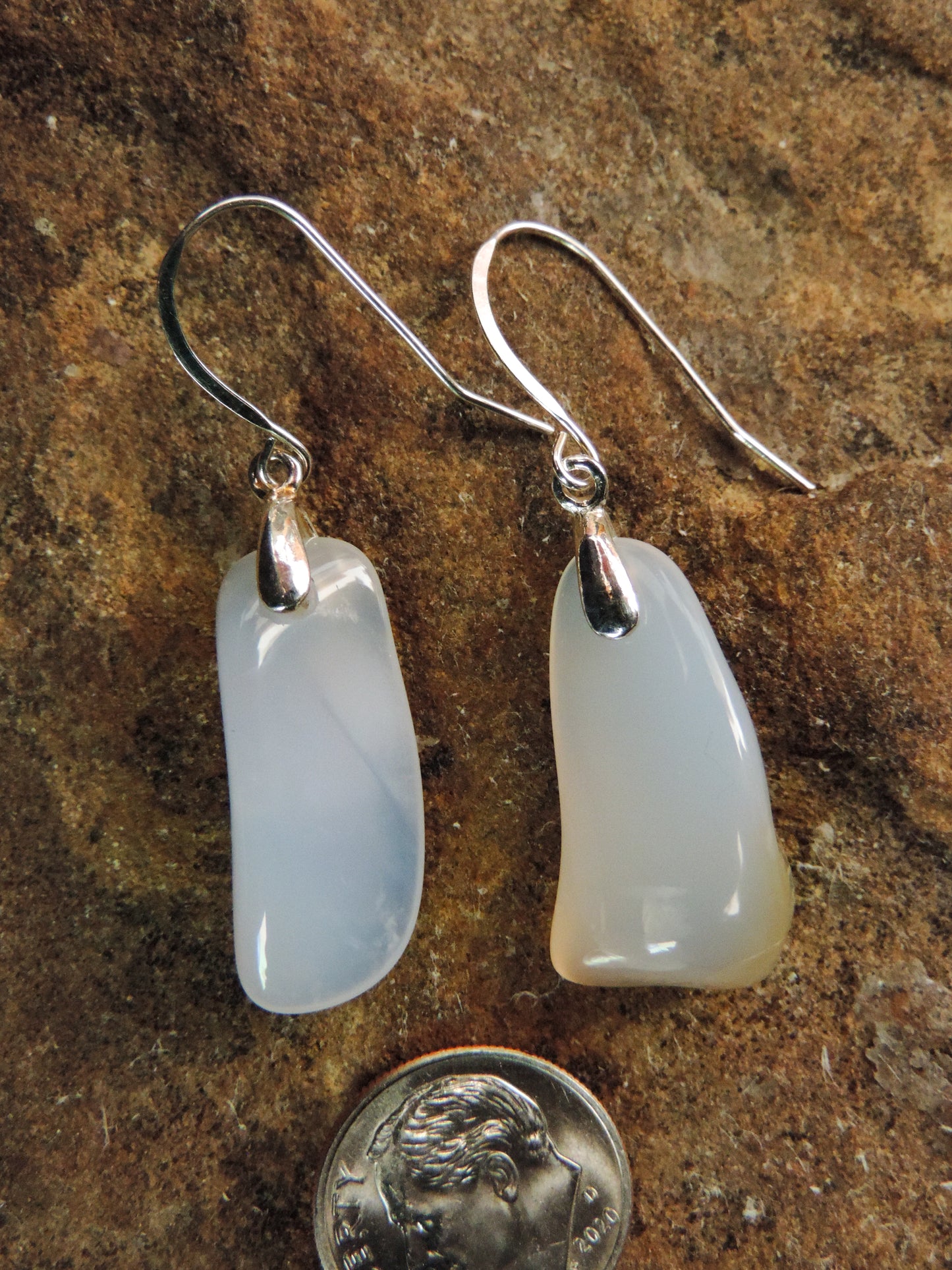 The bail and earring wires are authentic 925 sterling silver.  Wear these original earrings and stand out in a crowd!  Known as the Treasure State, Montana’s landscape is an abundant resource for precious and semi-precious stones.  One of the semi-precious stones, Madison Blue Agate, are featured in these earrings.  