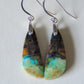 Indonesian Blue Opalized Wood & Sterling Silver Earrings  Extremely rare and lovely, Indonesian Blue Opalized Wood is a cherished material used by lapidary artists for creating stunning pieces of jewelry.