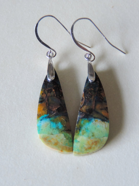 Indonesian Blue Opalized Wood & Sterling Silver Earrings  Extremely rare and lovely, Indonesian Blue Opalized Wood is a cherished material used by lapidary artists for creating stunning pieces of jewelry.