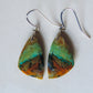 The bail and earring wires are authentic 925 sterling silver.  Feel treasured when you wear these earrings! Extremely rare and lovely, Indonesian Blue Opalized Wood is a cherished material used by lapidary artists for creating stunning pieces of jewelry.  The material was first found as pebbles and rounded stones in streams and near the slopes of three volcanoes in the West Java Province. 