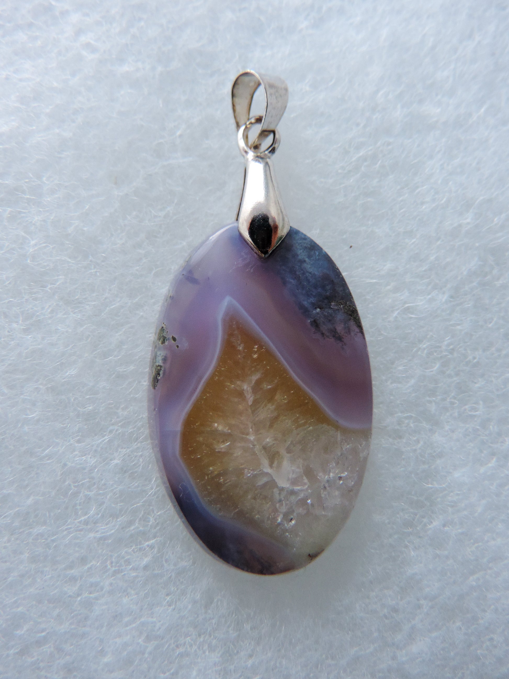 Purple Moss Agate Pendant  Purple Moss Agate Pendant gemstones hold significant and powerful spiritual qualities.  Purple has been associated with wealth, passion, ambition, magic, awareness, mystery, tranquility, inspiration, understanding, calmness and wisdom to name a few. 