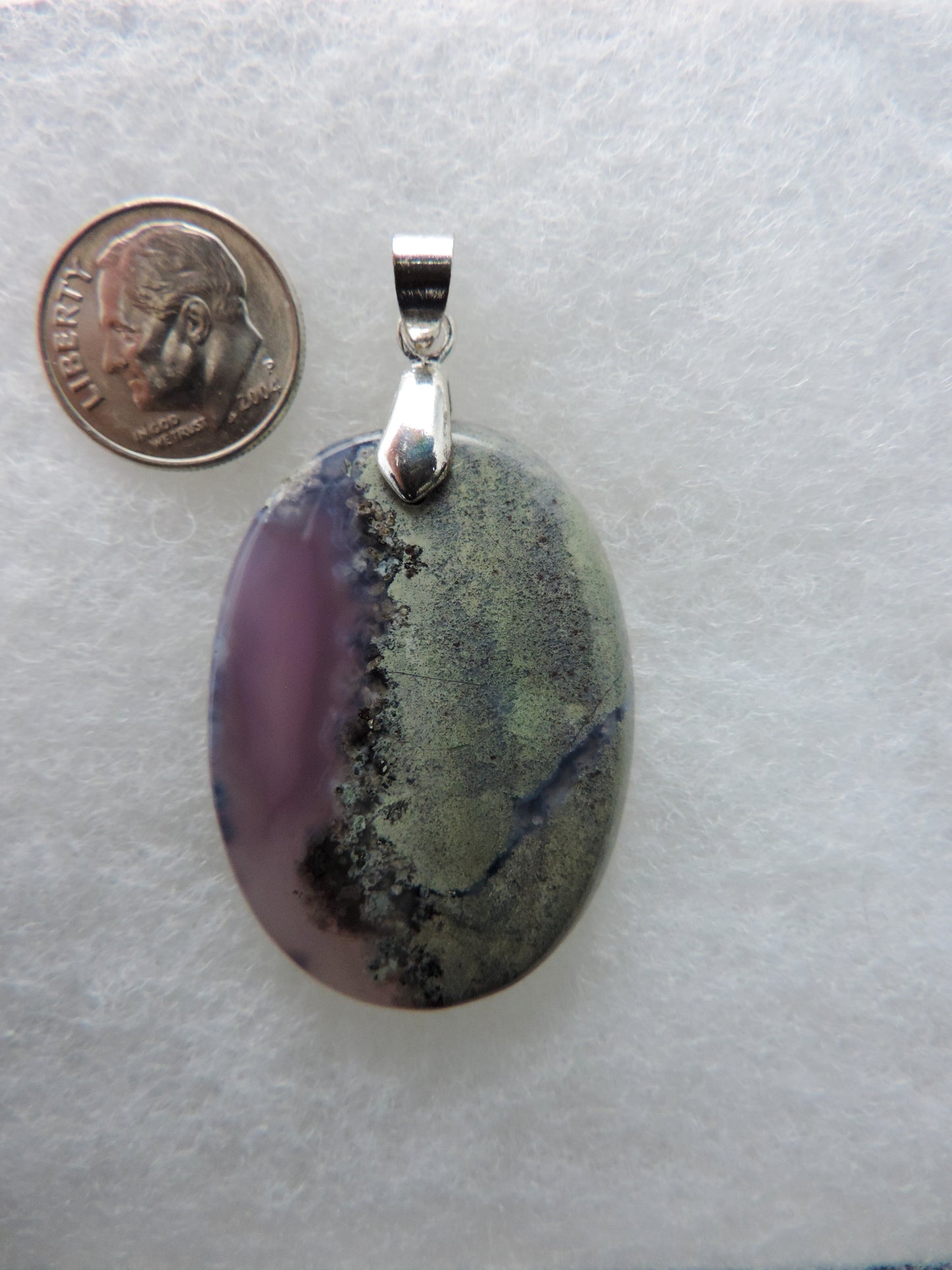 Our hand crafted jewelry is photographed next to a ruler for size.  This stone is a natural color, no dyes or heat treatment have been used. Purple gemstones hold significant and powerful spiritual qualities.  Purple has been associated with wealth, passion, ambition, magic, awareness, mystery, tranquility, inspiration, understanding, calmness and wisdom to name a few.  Purple Moss Agate from Java, Indonesia