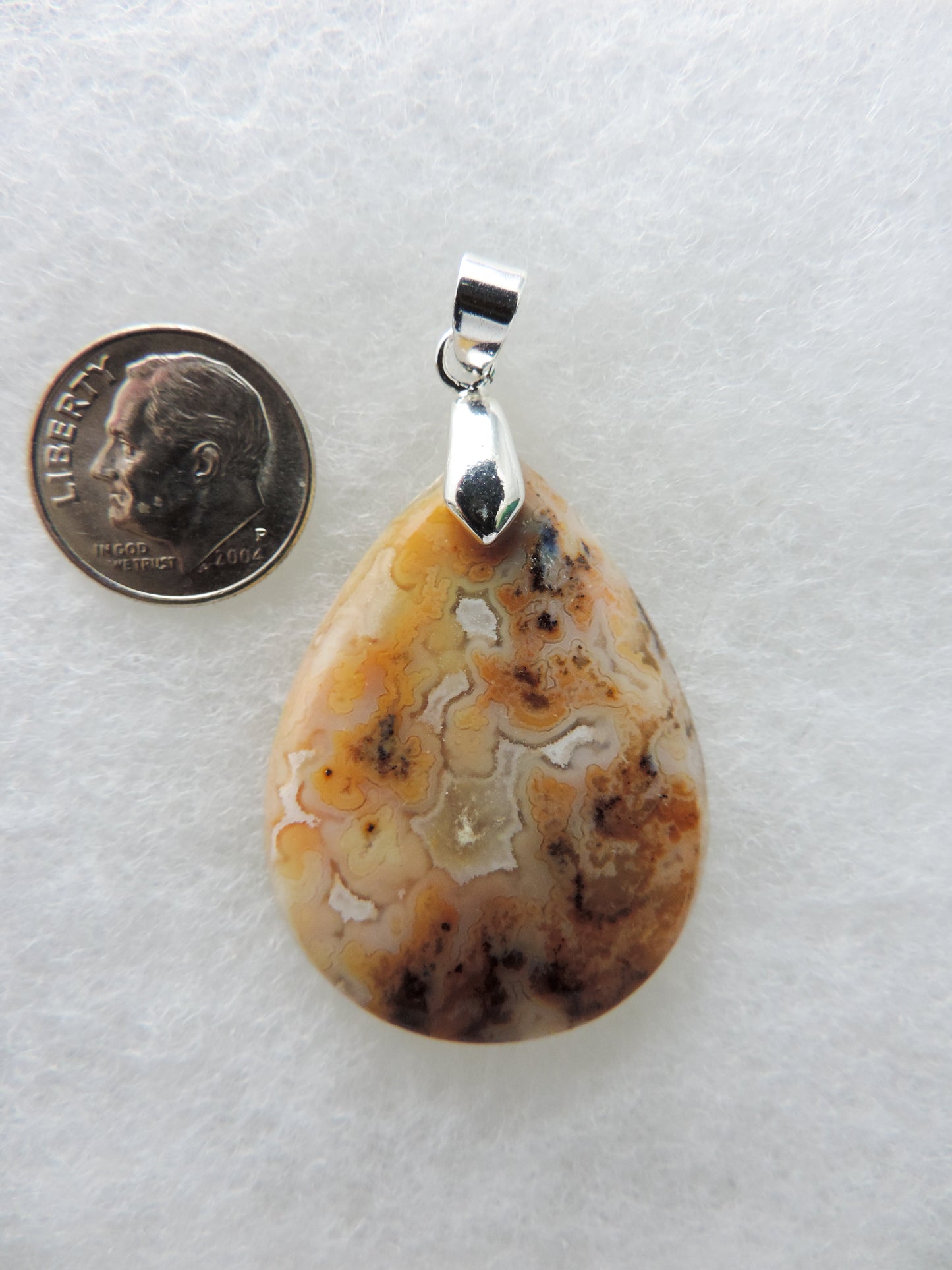 Find your perfect Indonesian Agate Moss Agate Pendant on our store!  Our hand crafted jewelry pendant is photographed next to a ruler for size.  This stone is a natural color, no dyes or heat treatment have been used.