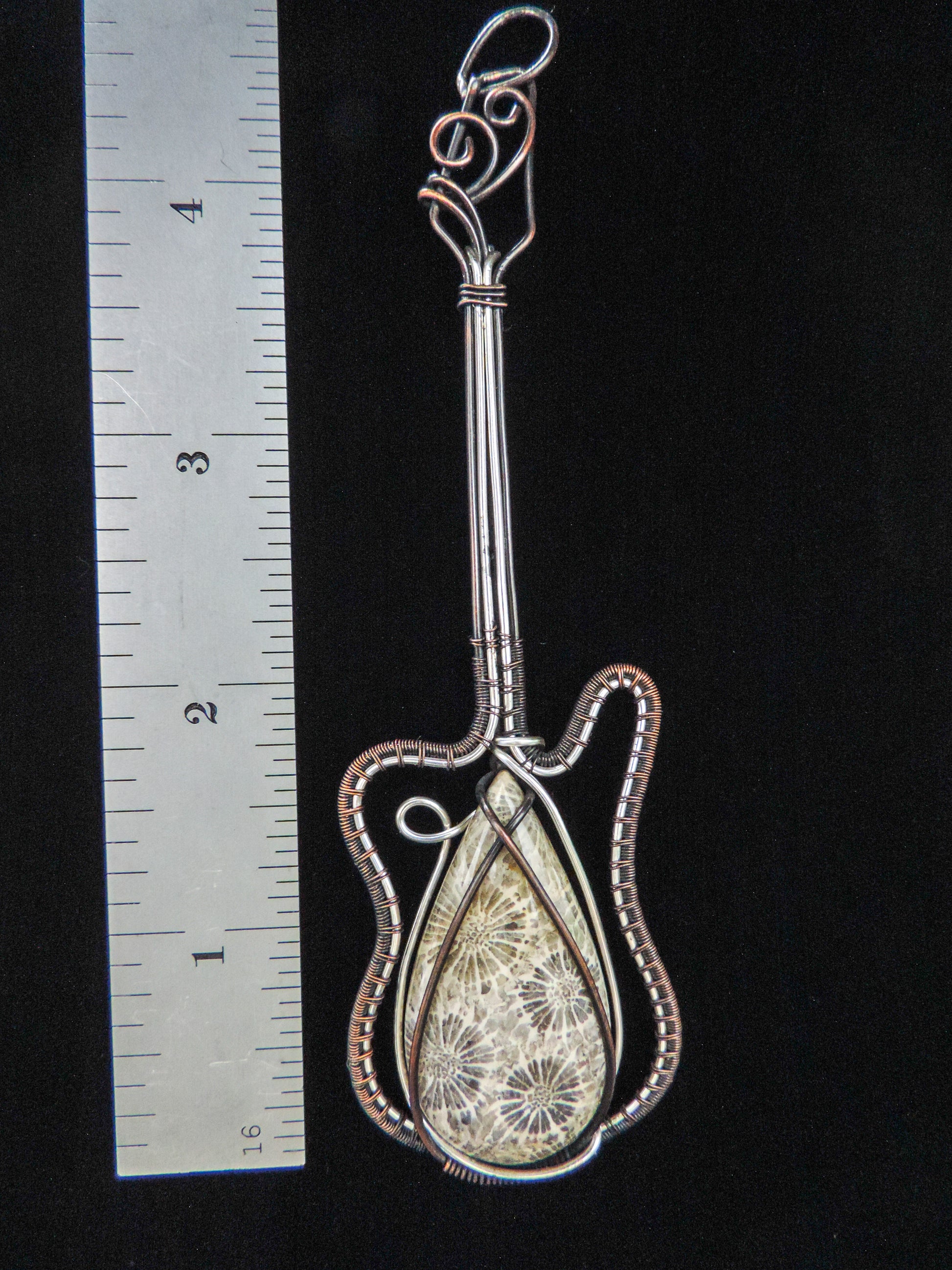 One of a kind Indonesian Fossil Coral & Mixed Metal Guitar Pendant that will be the envy of all your friends!  Our hand crafted jewelry pendant is photographed next to a ruler for size.  This stone is a natural color, no dyes or heat treatment have been used.  