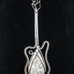 Indonesian Fossil Coral & Mixed Metal Guitar Pendant   Agatized fossil corals are found in several provinces across the Indonesian Islands of Sumatra and Java.  The fossil corals are remnants of ancient reefs thrust up onto the land mass by plate collisions.  Other discovery areas of well preserved agatized coral reefs are testament to the fact that sea levels were once much higher than today.  