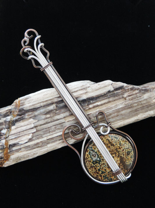 Indonesian River Jasper & Mixed Metals guitar pendant.