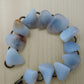 The stones in this bracelet are a unique result of tumble shaping and polishing agate from its natural state.  This one of kind bracelet will show off your unique taste!  Known as the Treasure State, Montana’s landscape is an abundant resource for precious and semi-precious stones.  One of the semi-precious stones, Madison Blue Agate, is featured in this bracelet.  This rare stone is found in only a few locations in Montana