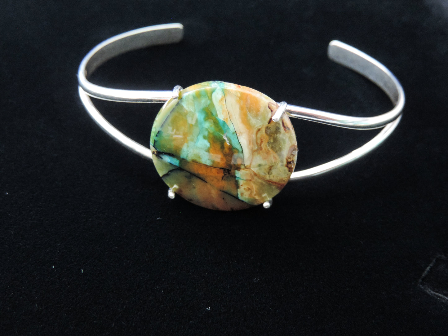 Extremely rare and lovely, Indonesian Blue Opalized Wood is a cherished material used by lapidary artists for creating stunning pieces of jewelry.The bracelet metal is authentic 925 sterling silver.Feel treasured when you wear this stunning bracelet!