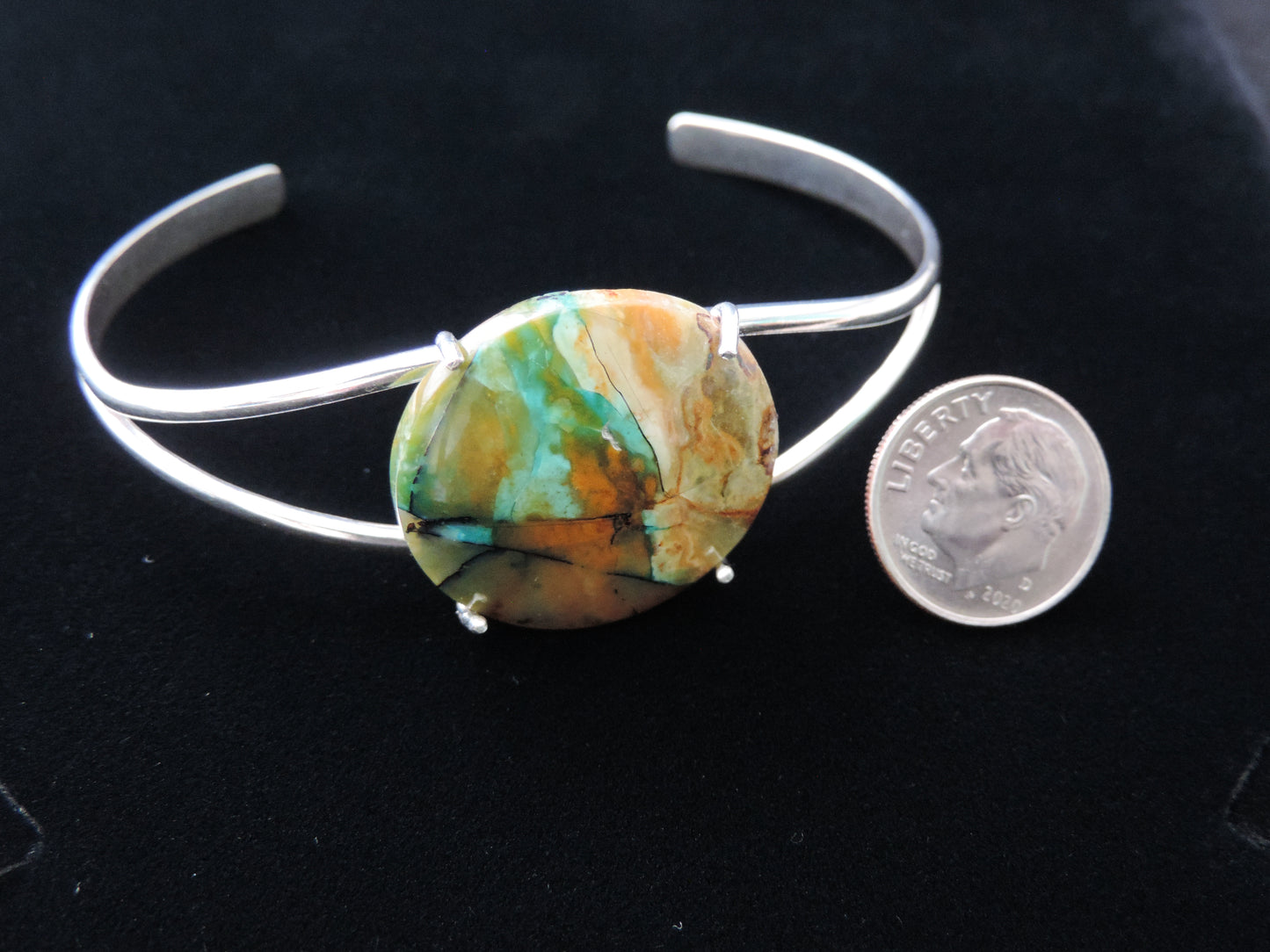 Extremely rare and lovely, Indonesian Blue Opalized Wood is a cherished material used by lapidary artists for creating stunning pieces of jewelry.The bracelet metal is authentic 925 sterling silver.Feel treasured when you wear this stunning bracelet!