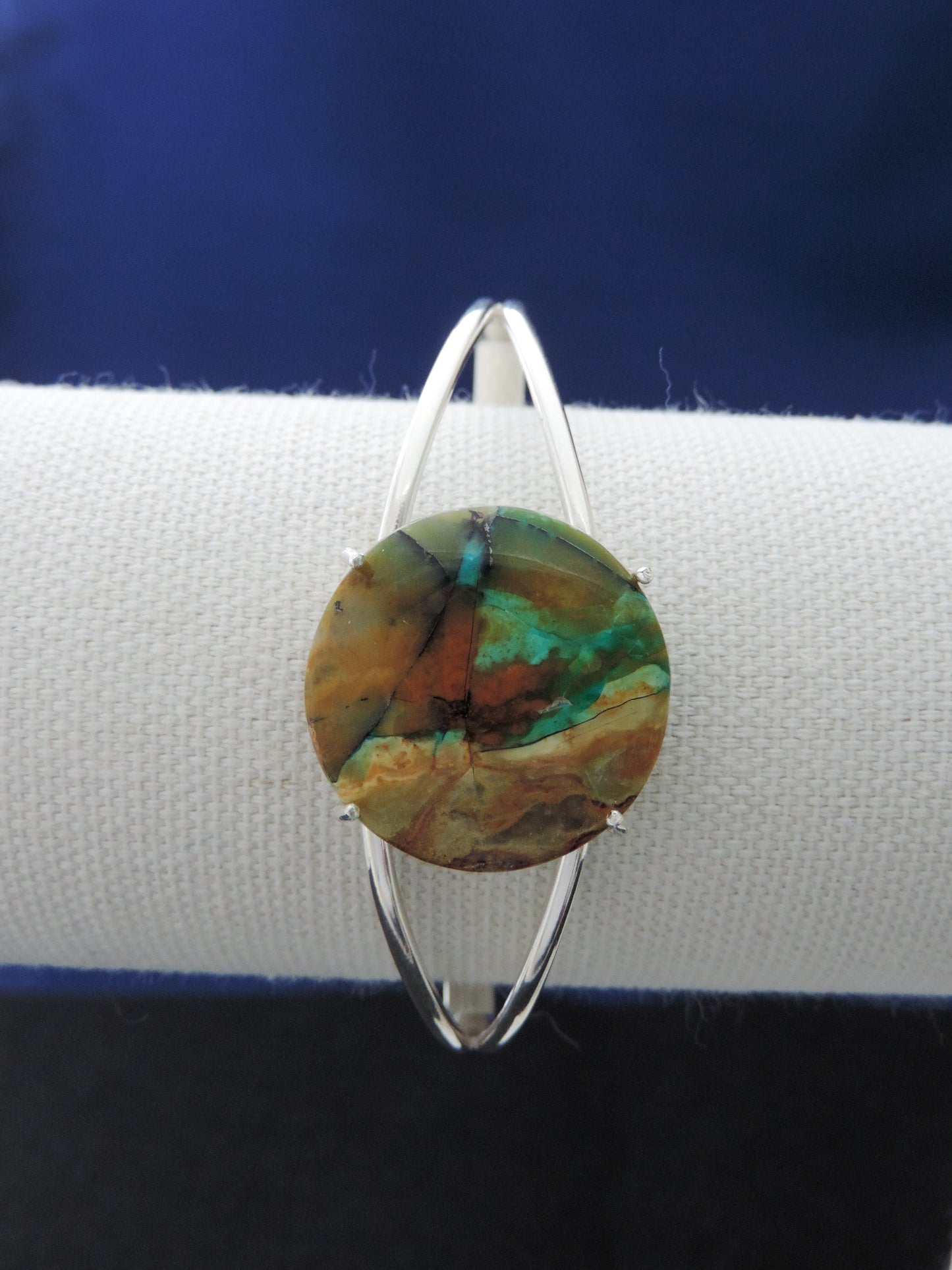 Extremely rare and lovely, Indonesian Blue Opalized Wood is a cherished material used by lapidary artists for creating stunning pieces of jewelry.The bracelet metal is authentic 925 sterling silver.Feel treasured when you wear this stunning bracelet!