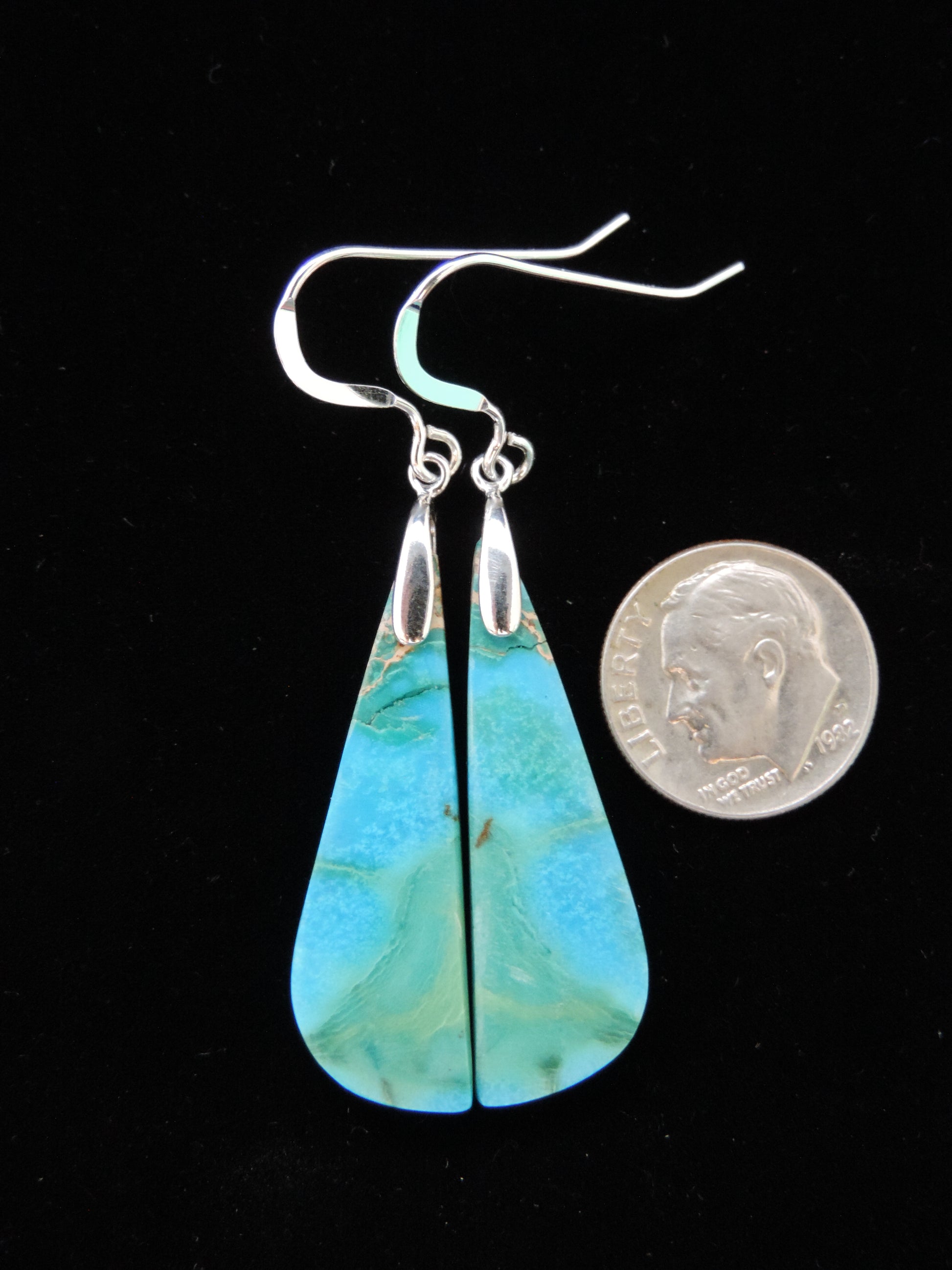 Pick your favorite pair of Indonesian Blue Opalized Wood Earrings and enjoy!     The bail and earring wire are authentic 925 sterling silver.  Our hand crafted jewelry earrings are  photographed next to a ruler for size.  This stone is a natural color, no dyes or heat treatment have been used.  