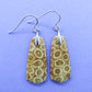 Indonesian Fossilized Coral Earrings & Sterling Silver  Agatized fossil corals are found in several provinces across the Indonesian Islands of Sumatra and Java.  The fossil corals are remnants of ancient reefs thrust up onto the land mass by plate collisions, and later found buried in the soils.  Some discovered areas of well preserved agatized coral reefs are testament to the fact that sea levels were once much higher than today as they are found much closer to the grounds surface.  