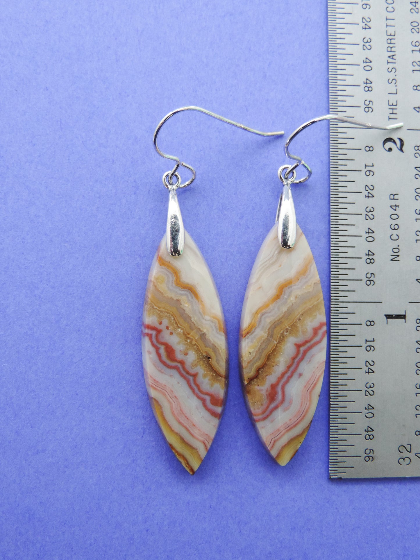 Our hand crafted jewelry earrings are photographed next to a ruler for size.  This stone is a natural color, no dyes or heat treatment have been used.  It was photographed without filters on automatic setting in natural light;