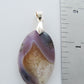 Throughout history, the spiritual meanings and properties of purple gemstones have always been positive as they were known to bring forth the purest aspirations of human kind.  The purple gemstones on this store come from Java, Indonesia.  Wear a Purple Moss Agate Pendant today!  Our hand crafted jewelry pendant is