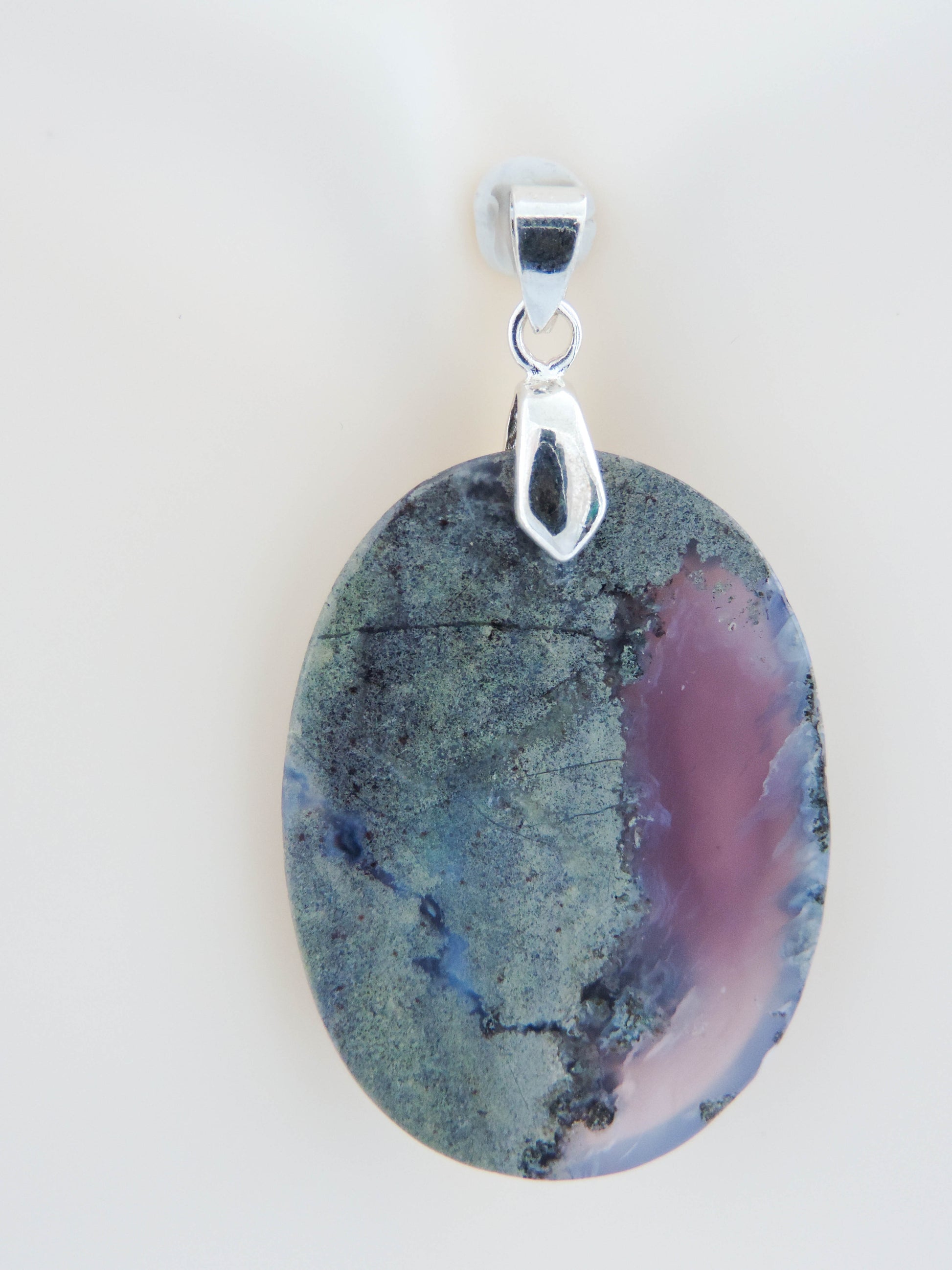 Our hand crafted jewelry is photographed next to a ruler for size.  This stone is a natural color, no dyes or heat treatment have been used. Purple gemstones hold significant and powerful spiritual qualities.  Purple has been associated with wealth, passion, ambition, magic, awareness, mystery, tranquility, inspiration, understanding, calmness and wisdom to name a few.  Purple Moss Agate from Java, Indonesia