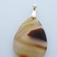 Find your perfect Indonesian Agate pendant on our store! 