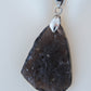 The Agni Manitite pendants on our store are unique in design.  One side is smooth and polished while the other side looks rough and irregular,