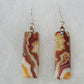 Our hand crafted jewelry earrings are photographed next to a ruler for size.  This stone is a natural color, no dyes or heat treatment have been used.  It was photographed without filters on automatic setting in natural light; however, slight color variations may occur due to digitization.  Natural stones can have nooks and crannies, inclusions or small cracks, these distinguishing features lend character to the piece.