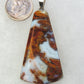 Find your perfect Indonesian Agate on our store!  Our hand crafted jewelry pendant is photographed next to a ruler for size.  It was photographed without filters on automatic setting in natural light; however, slight color variations may occur due to digitization. 