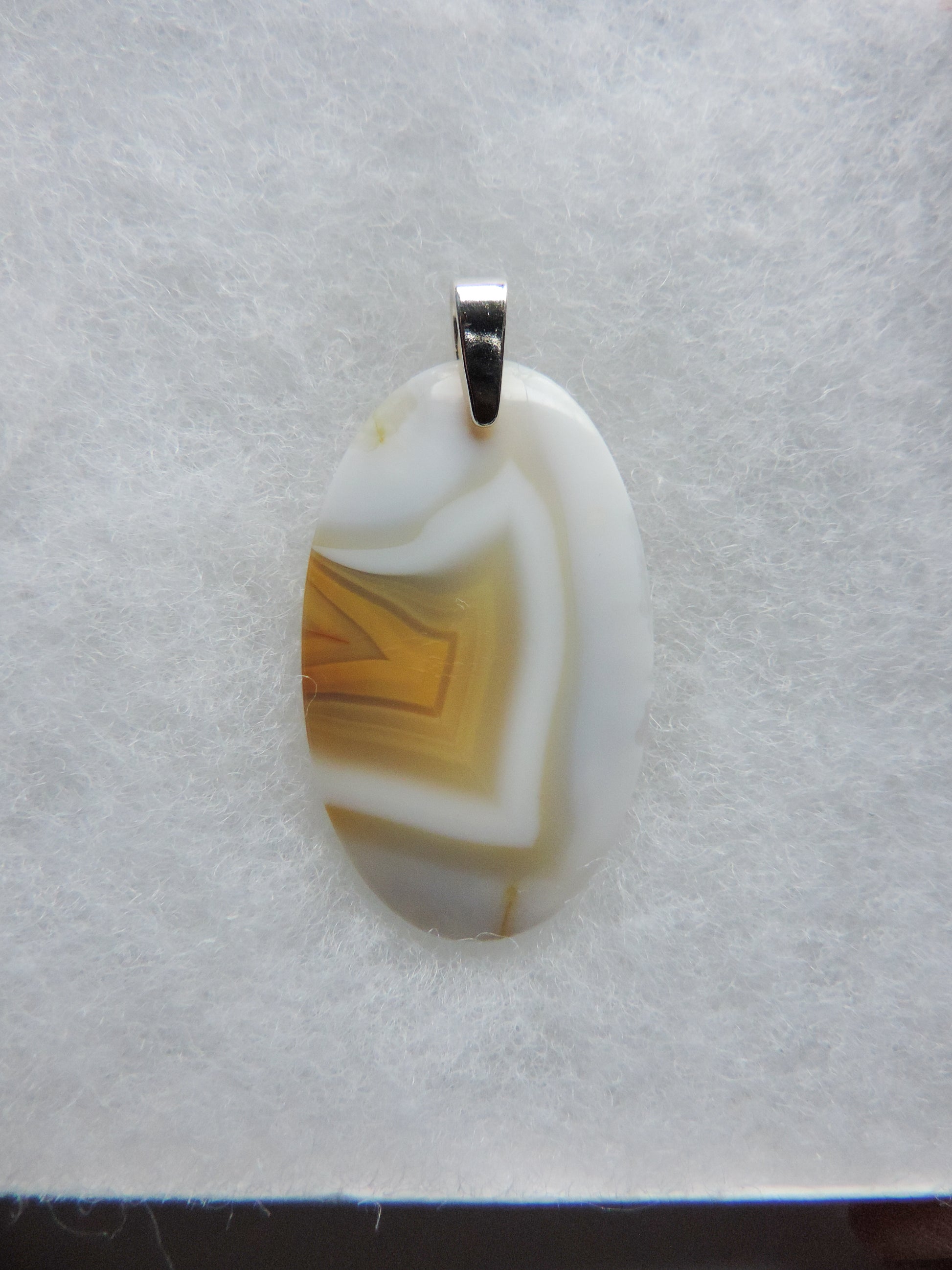 Find your perfect Indonesian Timor Agate & Sterling Silver Pendant on our store!  The pendant bail is authentic 925 sterling silver. 