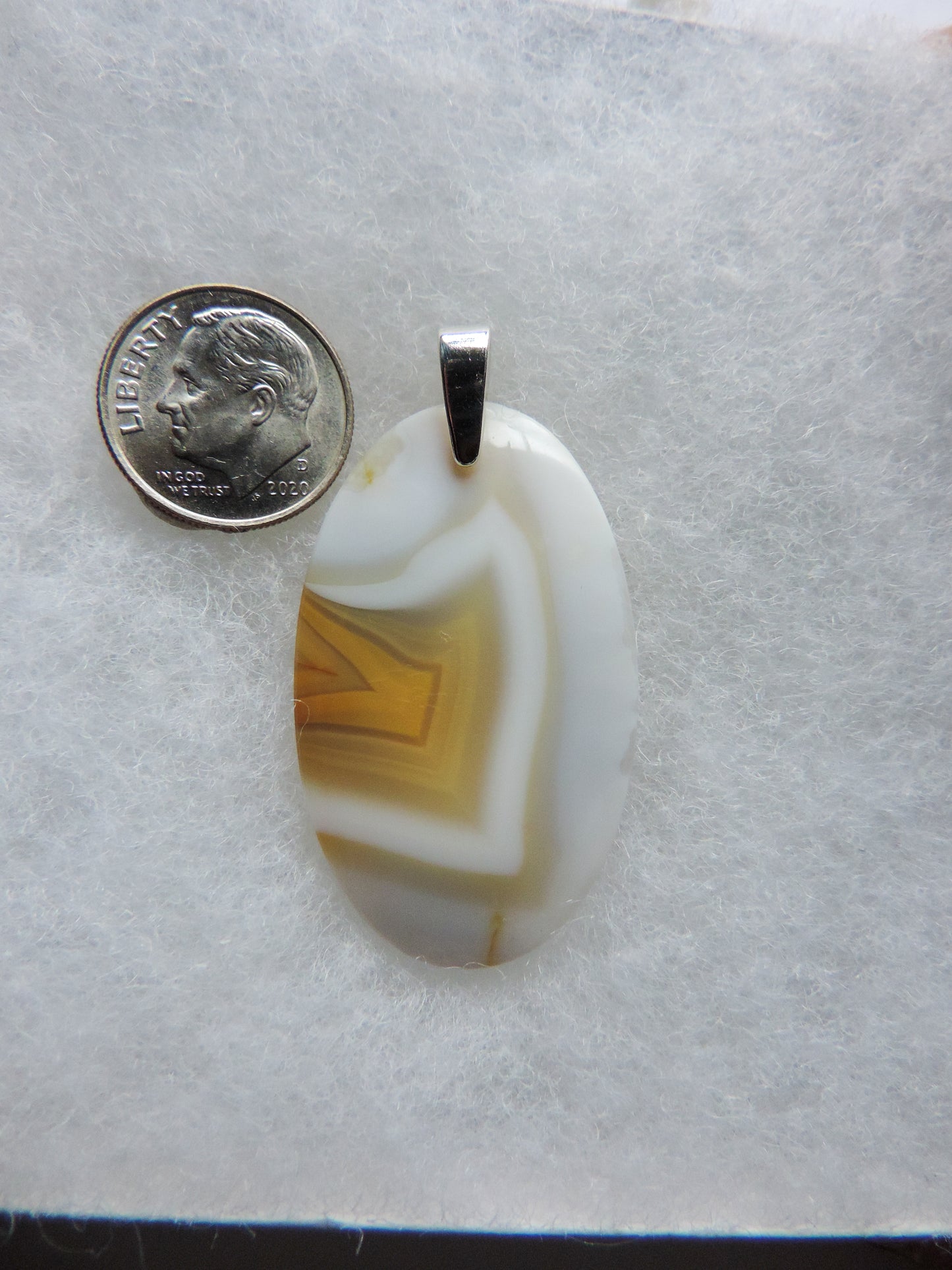 Find your perfect Indonesian Timor Agate & Sterling Silver Pendant on our store!  The pendant bail is authentic 925 sterling silver. 