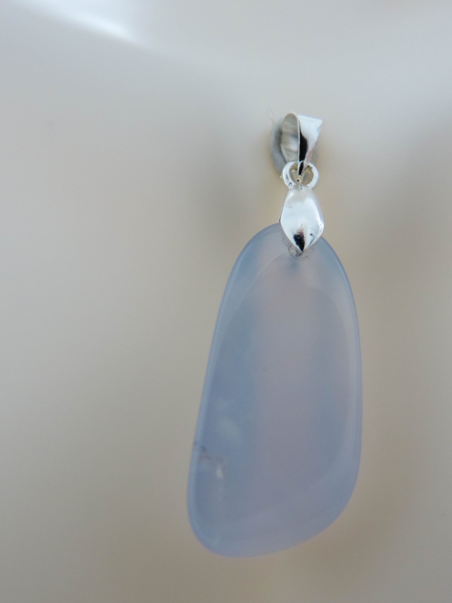 This rare stone is found in only a few locations in Montana, our material is hand collected on private property in the mountains and carried out in backpacks...each piece worth its weight in every step!  The translucent blue agate and its color variations have an alluring effect, many people find the blue agate a relaxing, calming and peaceful stone to wear.  Original and unique in design, each piece is hand crafted by lapidary artists in Montana. 