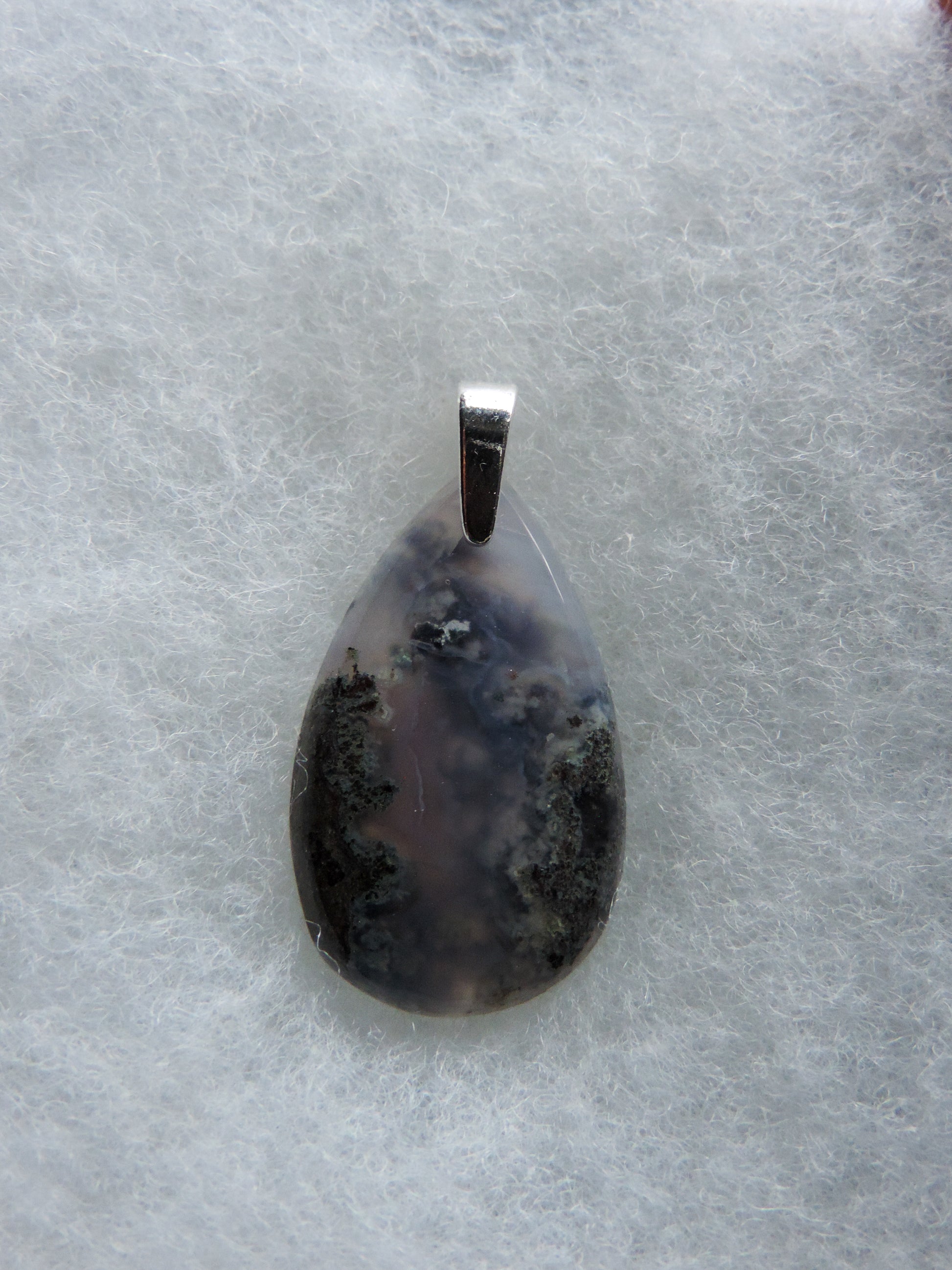 Wear a Purple Moss Agate Pendant today and feel the difference!!  The pendant bail is authentic 925 sterling silver.  Our hand crafted jewelry is photographed next to a ruler for size.  This stone is a natural color, no dyes or heat treatment have been used.  It was photographed without filters on automatic setting in natural light; however, slight color variations may occur due to digitization.  