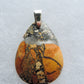 Exquisite in appearance, this Maligano Jasper & Sterling Silver Pendant will compliment your formal or casual attire.   The pendant bail is authentic 925 sterling silver.   Our hand crafted jewelry pendant is photographed next to a ruler for size.  