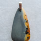 Our hand crafted pendant is photographed next to a ruler for size.  This stone is a natural color, no dyes or heat treatment have been used.  It was photographed without filters on automatic setting in natural light; however, slight color variations may occur due to digitization.  Natural stones can have nooks and crannies, inclusions or small cracks, these distinguishing features lend character to the piece.