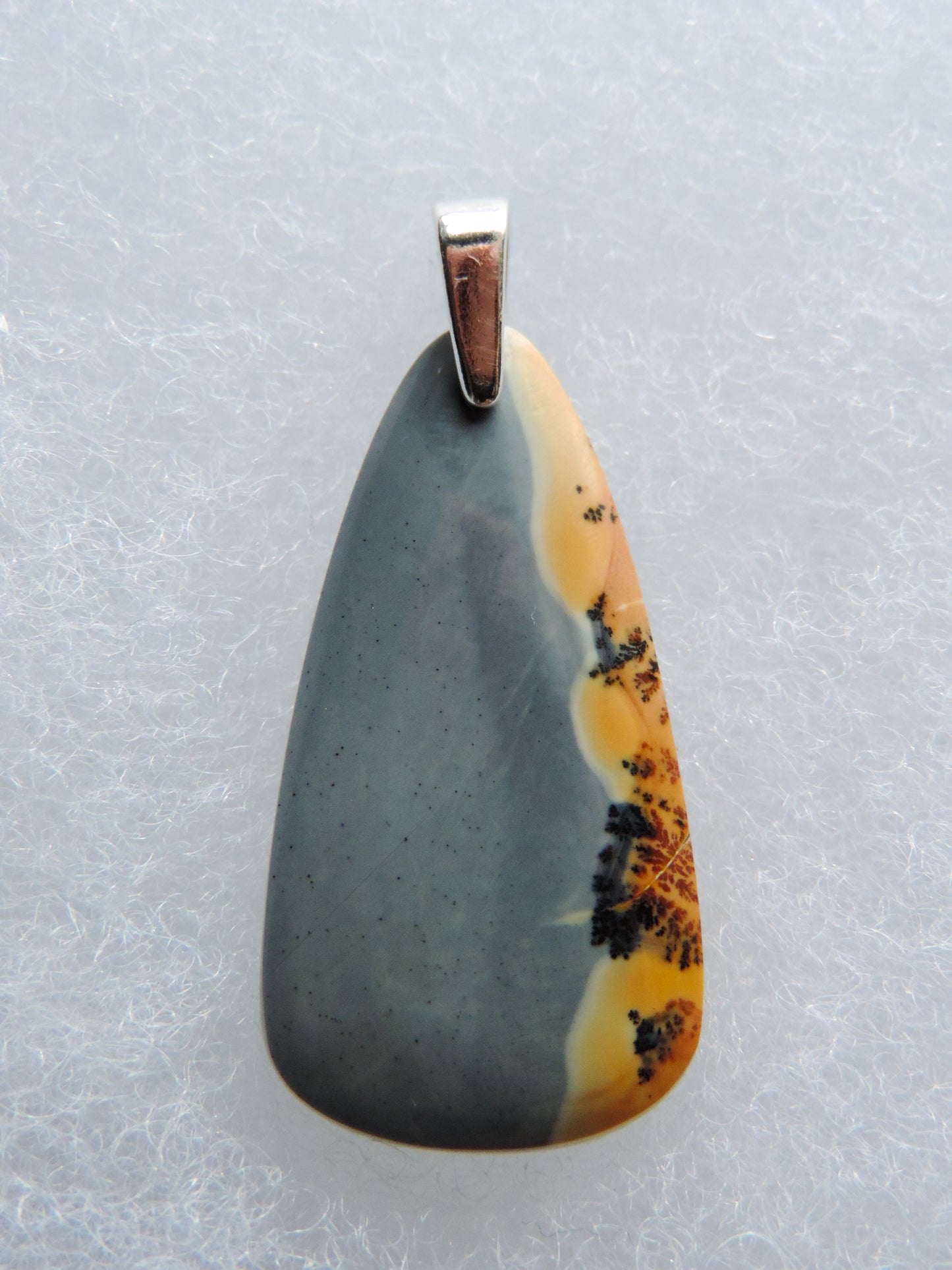 Our hand crafted pendant is photographed next to a ruler for size.  This stone is a natural color, no dyes or heat treatment have been used.  It was photographed without filters on automatic setting in natural light; however, slight color variations may occur due to digitization.  Natural stones can have nooks and crannies, inclusions or small cracks, these distinguishing features lend character to the piece.