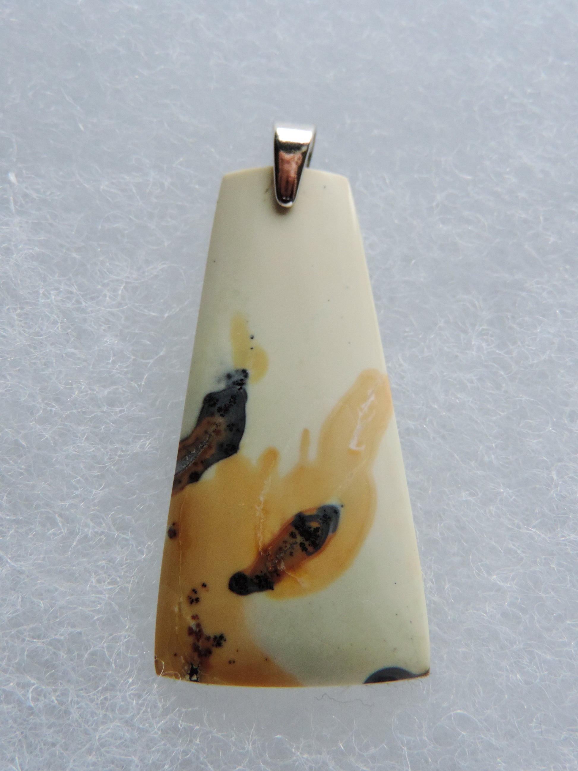 Exquisite in appearance, this Maligano Jasper & Sterling Silver Pendant will compliment your formal or casual attire.   The pendant bail is authentic 925 sterling silver.