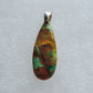 Indonesian Blue Opalized Wood & Sterling Silver Pendant.  Extremely rare and lovely, Indonesian Blue Opalized Wood is a cherished material used by lapidary artists for creating stunning pieces of jewelry