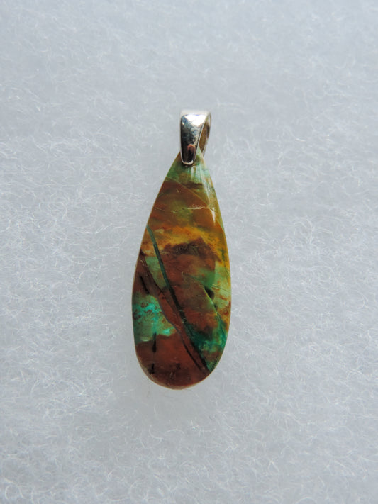 Indonesian Blue Opalized Wood & Sterling Silver Pendant.  Extremely rare and lovely, Indonesian Blue Opalized Wood is a cherished material used by lapidary artists for creating stunning pieces of jewelry