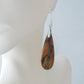 The bail and earring wires are authentic 925 sterling silver.  Feel treasured when you wear these earrings! Extremely rare and lovely, Indonesian Blue Opalized Wood is a cherished material used by lapidary artists for creating stunning pieces of jewelry.  The material was first found as pebbles and rounded stones in streams and near the slopes of three volcanoes in the West Java Province.