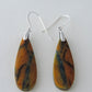 The bail and earring wires are authentic 925 sterling silver.  Feel treasured when you wear these earrings! Extremely rare and lovely, Indonesian Blue Opalized Wood is a cherished material used by lapidary artists for creating stunning pieces of jewelry.  The material was first found as pebbles and rounded stones in streams and near the slopes of three volcanoes in the West Java Province.