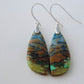 Indonesian Blue Opalized Wood & Sterling Silver Earrings  Extremely rare and lovely, Indonesian Blue Opalized Wood is a cherished material used by lapidary artists for creating stunning pieces of jewelry. 