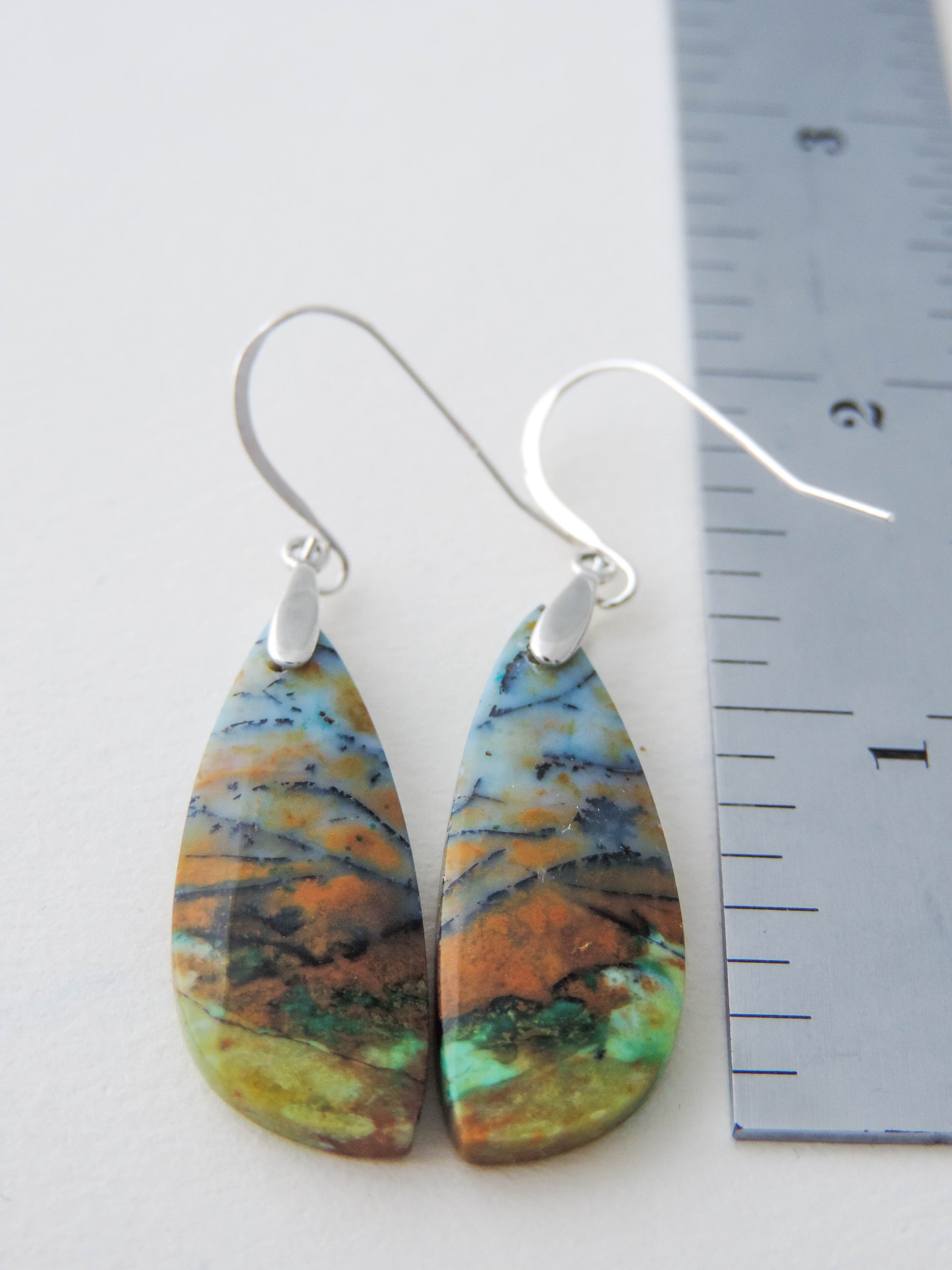 These rich minerals are responsible for the amazing colors in the stone.  The bail and earring wires are authentic 925 sterling silver.  Feel treasured when you wear these beautiful Indonesian Blue Opalized Wood Earrings!