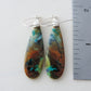 The bail and earring wires are authentic 925 sterling silver.  Feel treasured when you wear these earrings!Extremely rare and lovely, Indonesian Blue Opalized Wood is a cherished material used by lapidary artists for creating stunning pieces of jewelry.  The material was first found as pebbles and rounded stones in streams and near the slopes of three volcanoes in the West Java Province.  