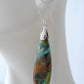 The bail and earring wires are authentic 925 sterling silver.  Feel treasured when you wear these earrings!Extremely rare and lovely, Indonesian Blue Opalized Wood is a cherished material used by lapidary artists for creating stunning pieces of jewelry.  The material was first found as pebbles and rounded stones in streams and near the slopes of three volcanoes in the West Java Province.  