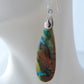 The bail and earring wires are authentic 925 sterling silver.  Feel treasured when you wear these earrings!Extremely rare and lovely, Indonesian Blue Opalized Wood is a cherished material used by lapidary artists for creating stunning pieces of jewelry.  The material was first found as pebbles and rounded stones in streams and near the slopes of three volcanoes in the West Java Province.  