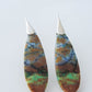 Extremely rare and lovely, Indonesian Blue Opalized Wood is a cherished material used by lapidary artists for creating stunning pieces of jewelry.  The material was first found as pebbles and rounded stones in streams and near the slopes of three volcanoes in the West Java Province. The bail and earring wires are authentic 925 sterling silver.  Feel treasured when you wear these earrings!