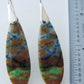 Extremely rare and lovely, Indonesian Blue Opalized Wood is a cherished material used by lapidary artists for creating stunning pieces of jewelry.  The material was first found as pebbles and rounded stones in streams and near the slopes of three volcanoes in the West Java Province. The bail and earring wires are authentic 925 sterling silver.  Feel treasured when you wear these earrings!