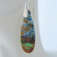 Extremely rare and lovely, Indonesian Blue Opalized Wood is a cherished material used by lapidary artists for creating stunning pieces of jewelry.  The material was first found as pebbles and rounded stones in streams and near the slopes of three volcanoes in the West Java Province. The bail and earring wires are authentic 925 sterling silver.  Feel treasured when you wear these earrings!