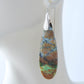 Extremely rare and lovely, Indonesian Blue Opalized Wood is a cherished material used by lapidary artists for creating stunning pieces of jewelry.  The material was first found as pebbles and rounded stones in streams and near the slopes of three volcanoes in the West Java Province. The bail and earring wires are authentic 925 sterling silver.  Feel treasured when you wear these earrings!