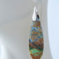 Extremely rare and lovely, Indonesian Blue Opalized Wood is a cherished material used by lapidary artists for creating stunning pieces of jewelry.  The material was first found as pebbles and rounded stones in streams and near the slopes of three volcanoes in the West Java Province. The bail and earring wires are authentic 925 sterling silver.  Feel treasured when you wear these earrings!